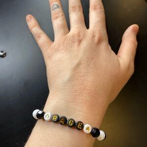 Handmade Black & White Beaded 'RAGE' Letter Bracelet